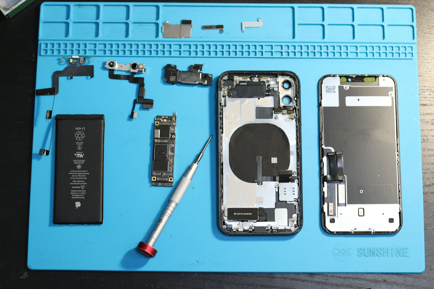 Device parts laid out and documented before grading