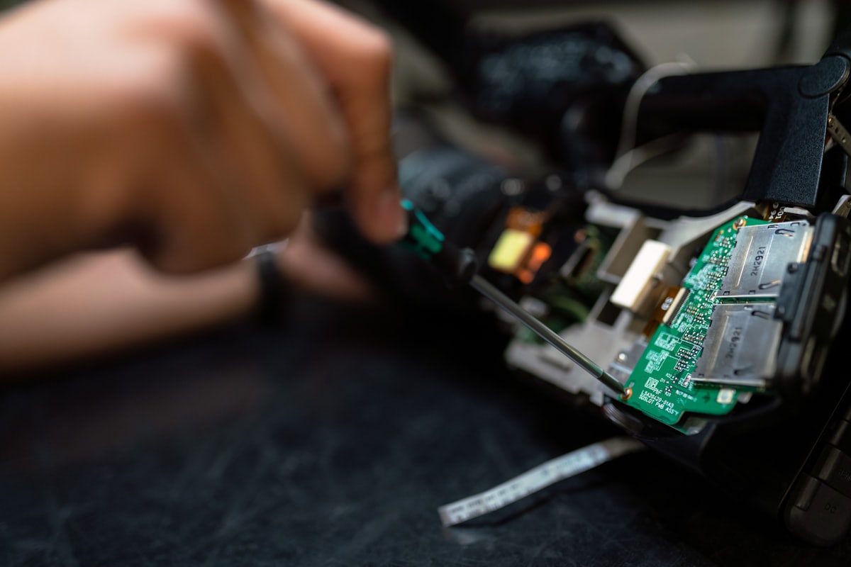 Technician repairing an electronic circuit board